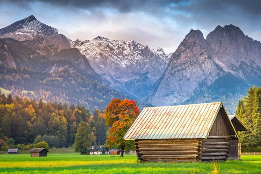 Bavarian alps and rustic farm barns, Garmisch Partenkirchen, Zugspitze massif, Bavaria, Germany