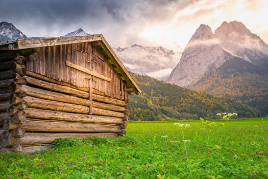 Bavarian alps and rustic farm barns, Garmisch Partenkirchen, Zugspitze massif, Bavaria, Germany