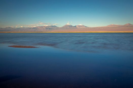 Licancabur and Peaceful reflection lake with dramatic volcanic landscape at Sunset, Atacama Desert, Chile