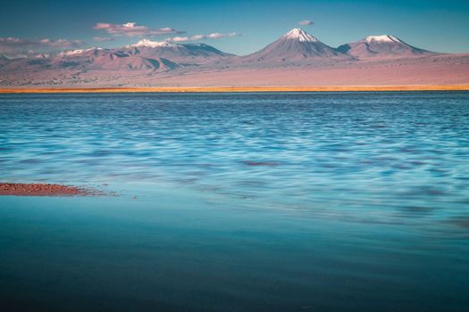 Licancabur and Peaceful reflection lake with dramatic volcanic landscape at Sunset, Atacama Desert, Chile