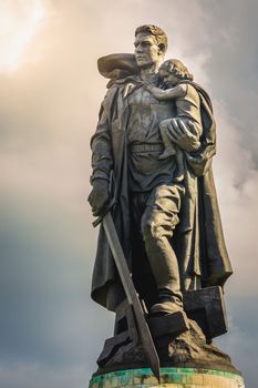 Statue of the heroic Soldier Liberator in Soviet War Memorial at sunset, Berlin, Germany