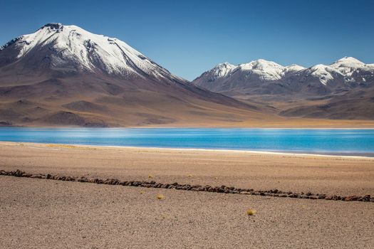 Salt lake Laguna Miscanti, and idyllic volcanic landscape at sunrise, Atacama desert, Chile border with Bolivia