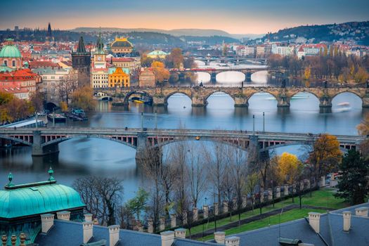 Panoramic view over the cityscape of Prague and Vltava river at dramatic evening, Czech Republic