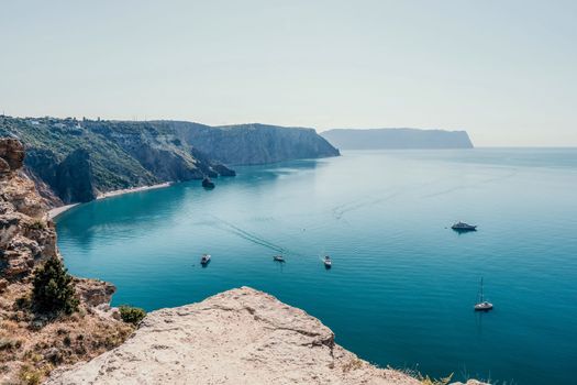 Aerial panoramic view of beautiful sunset above sea. Beautiful seascape. Sun glare, small waves on the water surface. Evening. Horizon. Nobody. No people. Copy space. Never-ending beauty of nature