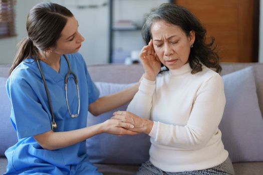 Portrait of a female doctor holding a patient's hand to encourage the fight against disease