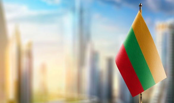 A small Lithuania flag on an abstract blurry background.