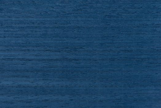 Blue wood texture. The texture of koto wood with a bluish tinge. Exotic rare wood from Africa for the production of expensive furniture or interior elements.