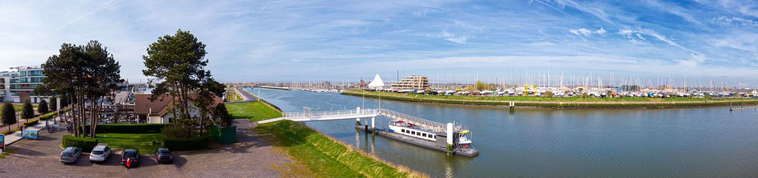 panoramic highangle view on the marina of Nieuwpoort in a spring light with boats on the shore