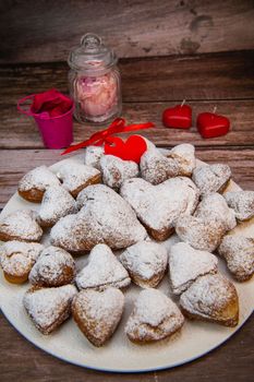 Recipe for soft heart-shaped doughnuts for Valentine's Day. High quality photo