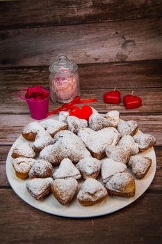 Recipe for soft heart-shaped doughnuts for Valentine's Day. High quality photo