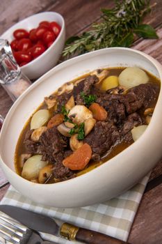 Beef bourguignon recipe, beef stew with wine sauce and vegetables. High quality photo