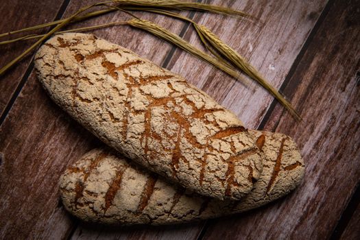 Rye bread on brown background. High quality photo