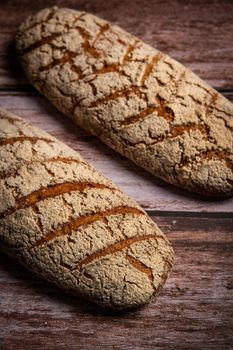 Rye bread on brown background. High quality photo