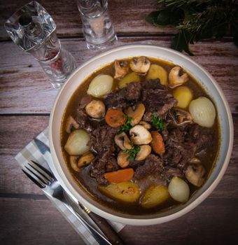 Beef bourguignon recipe, beef stew with wine sauce and vegetables. High quality photo
