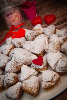 Recipe for soft heart-shaped doughnuts for Valentine's Day. High quality photo