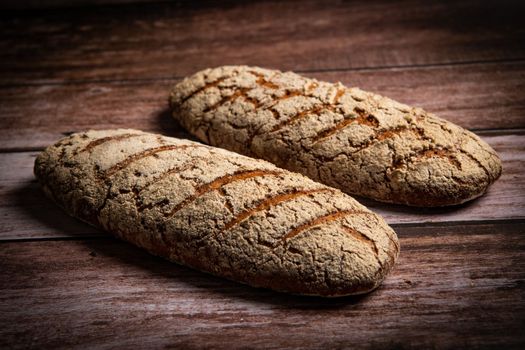 Rye bread on brown background. High quality photo