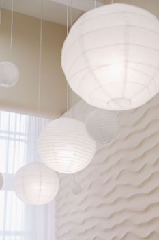 Beige paper lamps in modern interior. cozy home interior.