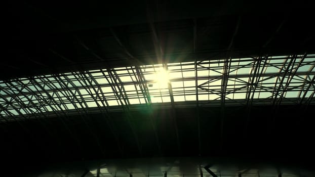 the sun shines through the roof of the airport pavilion. High quality photo