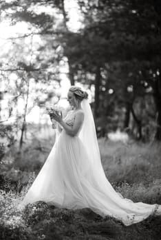 bride blonde girl with a bouquet in the forest in the sunset light