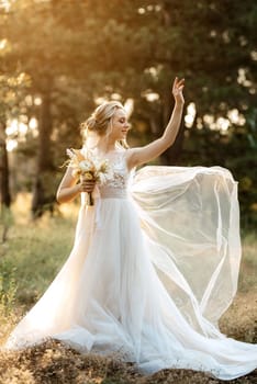 bride blonde girl with a bouquet in the forest in the sunset light