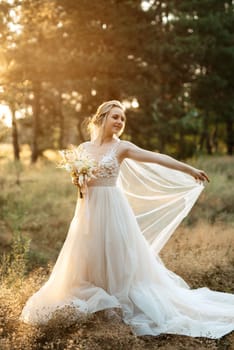 bride blonde girl with a bouquet in the forest in the sunset light