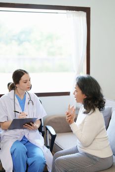 Portrait of a female doctor holding a patient clipboard to discuss and analyze wrist and finger pain