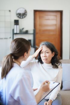 Portrait of a female doctor holding a patient clipboard to discuss and analyze the patient's condition before treating