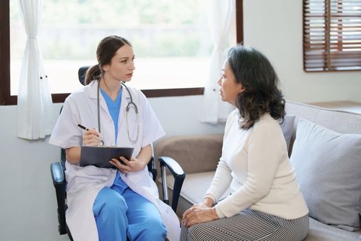 Portrait of a female doctor holding a patient clipboard to discuss and analyze the patient's condition before treating