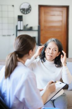 Portrait of a female doctor holding a patient clipboard to discuss and analyze the patient's condition before treating