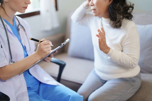 Portrait of a female doctor holding a patient clipboard to discuss and analyze the patient's condition before treating