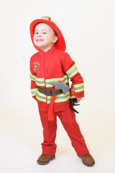 Little toddler child, playing with fire truck car toy and little chicks at home, kid and pet friends playing.