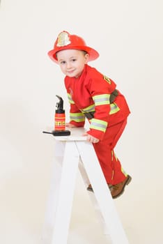 Little toddler child, playing with fire truck car toy and little chicks at home, kid and pet friends playing.