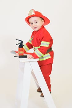 Little toddler child, playing with fire truck car toy and little chicks at home, kid and pet friends playing.