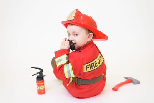 Little toddler child, playing with fire truck car toy and little chicks at home, kid and pet friends playing.