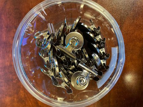 Plastic container of Magnetic Bulldog Clips for the office . High quality photo