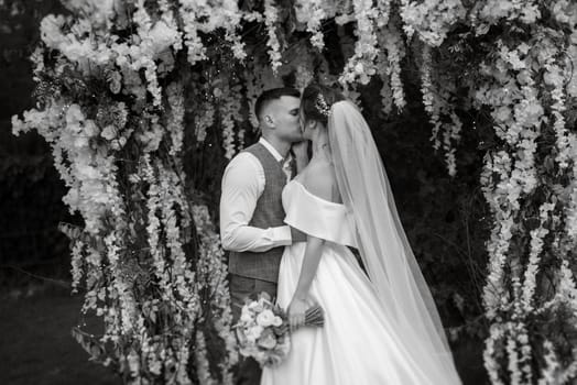 wedding ceremony of the newlyweds on the glade near the restaurant