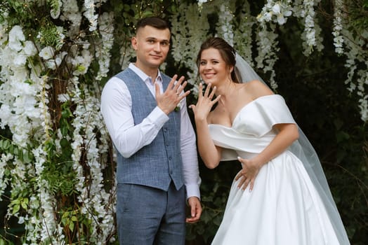 wedding ceremony of the newlyweds on the glade near the restaurant