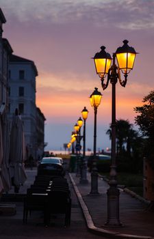 View of street lantern illuminated in Trieste, Italy