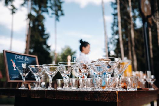 A lot of empty glasses are on the table for the beginning of the holiday.