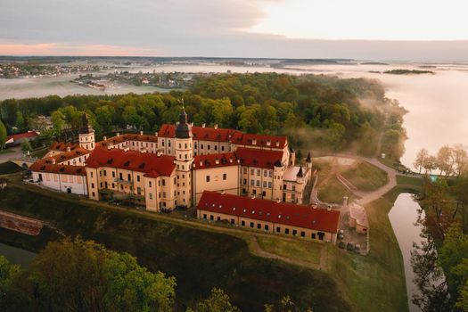 Nesvizh castle is a residential castle of the Radziwill family in Nesvizh, Belarus, with a beautiful view from above at dawn.