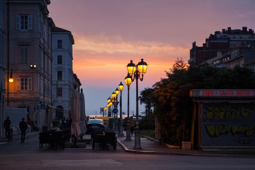 View of street lantern illuminated in Trieste, Italy