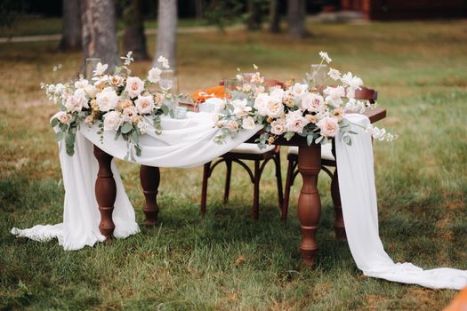 wedding table decoration with flowers on the table, dinner table decor.