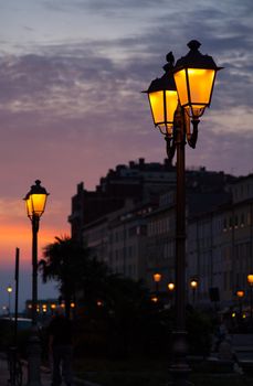 View of street lantern illuminated in Trieste, Italy