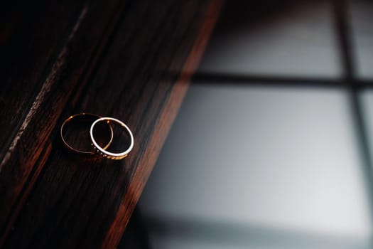 Close-up of two gold wedding rings for a wedding.