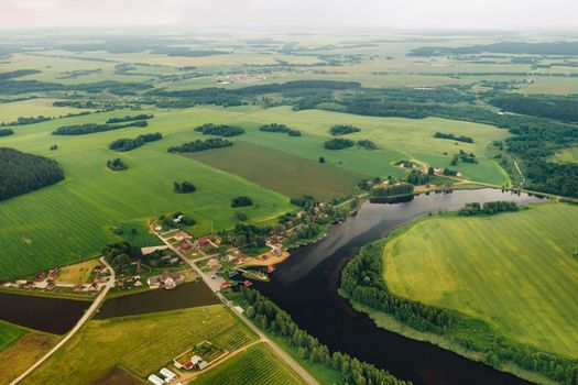 view from the height of the Lake in a green field in the form of a horseshoe and a village in the Mogilev region.Belarus.The Nature Of Belarus.