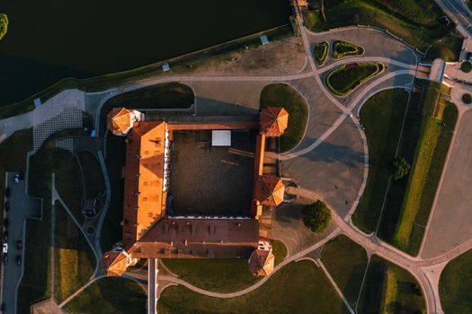 Mir castle with spires near the lake top view in Belarus near the city of Mir.