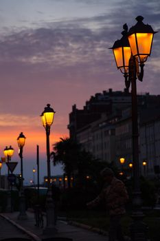 View of street lantern illuminated in Trieste, Italy
