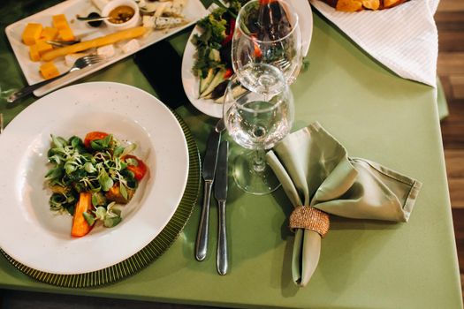 Dishes on the wedding table, decor of the dining table for the holiday.