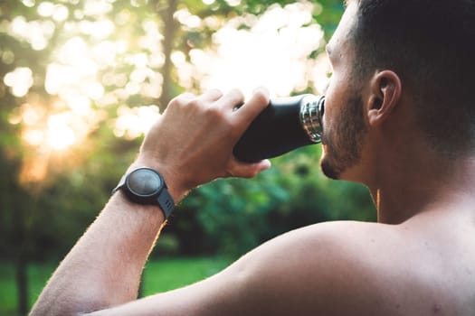 Fit man checking smart watch wearable technology sport smartwatch on workout outside. Man wearing smart watch during his training, measuring his activity. High quality photo