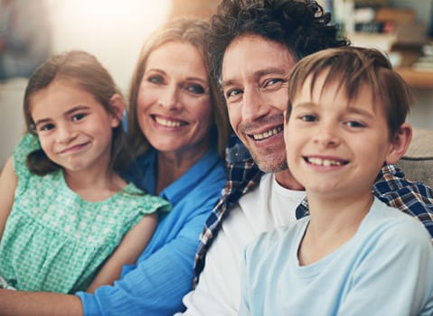 Enjoying the people with the people we love. Portrait of a happy family relaxing on the sofa together at home